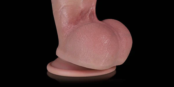 Flesh Kimi realistic dildo rounded testicles on black background