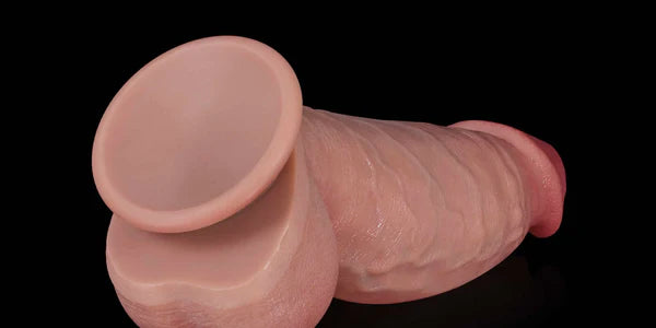 Flesh Kimi realistic dildo suction base on black background